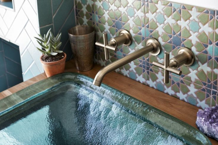 Modern home highlighting filtered water flowing to showers, sinks, laundry room, dishwasher, and water heater. Whole House Water Filter vs Reverse Osmosis
